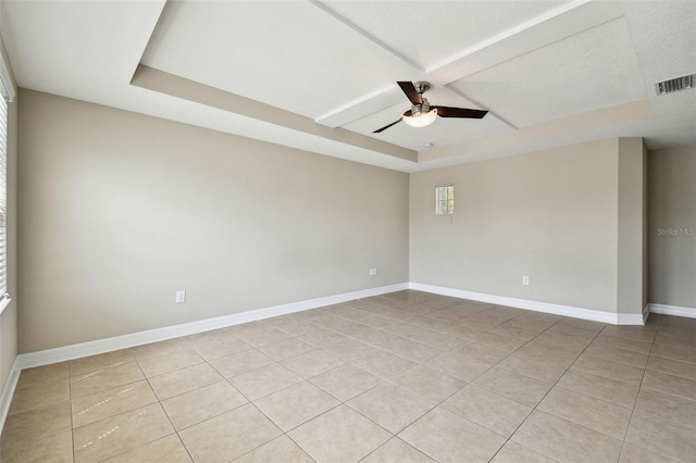 4544 Vermillion Sky Dr, Wesley Chapel, FL 33544 - unfurnished room featuring light tile patterned floors, a ceiling fan, a raised ceiling, and coffered ceiling