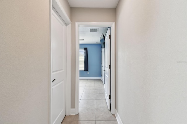 4544 Vermillion Sky Dr, Wesley Chapel, FL 33544 - hallway with light tile patterned floors and baseboards