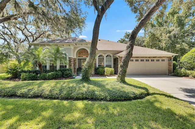 5804 Terncrest Dr, Lithia, FL 33547 - mediterranean / spanish-style house with a garage, driveway, and a front yard