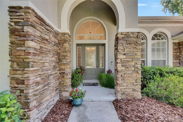5804 Terncrest Dr, Lithia, FL 33547 - entrance to property featuring stucco siding and stone siding