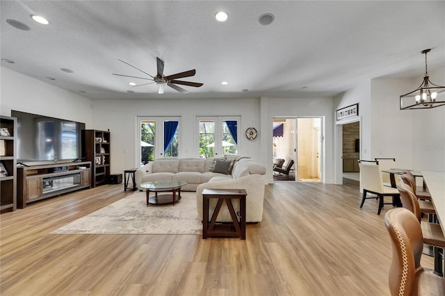 5804 Terncrest Dr, Lithia, FL 33547 - living area with ceiling fan, light wood finished floors, a chandelier, recessed lighting, and a textured ceiling