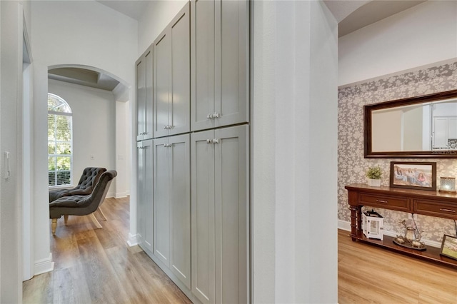 5804 Terncrest Dr, Lithia, FL 33547 - corridor featuring arched walkways, light wood-type flooring, and wallpapered walls