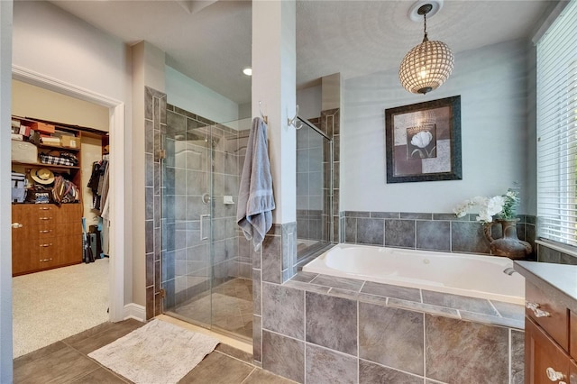 5804 Terncrest Dr, Lithia, FL 33547 - full bath with a stall shower, a garden tub, a spacious closet, and vanity