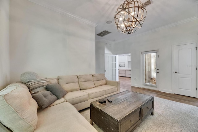 5804 Terncrest Dr, Lithia, FL 33547 - living room featuring a chandelier, ornamental molding, and light wood finished floors