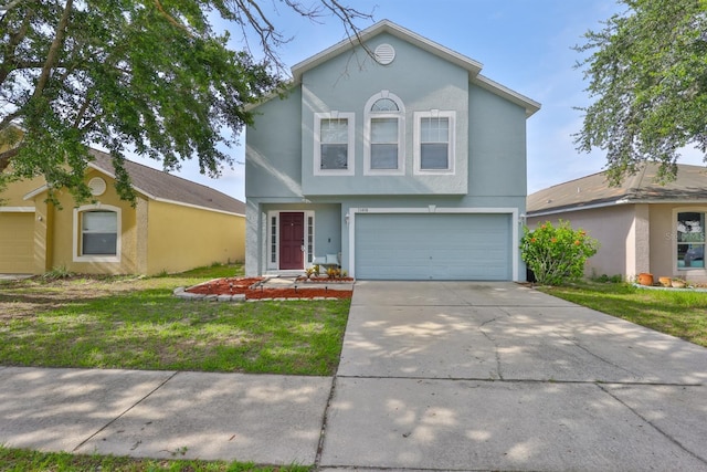 11438 Ivy Flower Loop, Riverview, FL 33578 - view of front of home with stucco siding, an attached garage, concrete driveway, and a front yard