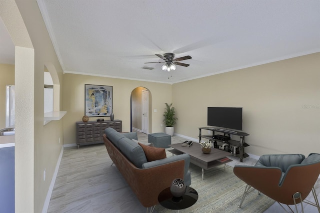 11438 Ivy Flower Loop, Riverview, FL 33578 - living area with arched walkways, ceiling fan, and crown molding