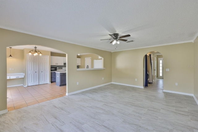 11438 Ivy Flower Loop, Riverview, FL 33578 - unfurnished living room with a ceiling fan, crown molding, arched walkways, light tile patterned floors, and a textured ceiling