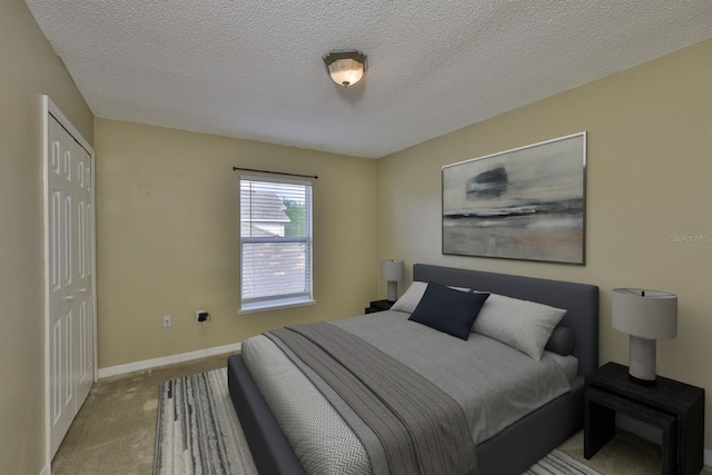 11438 Ivy Flower Loop, Riverview, FL 33578 - bedroom featuring carpet flooring and a textured ceiling