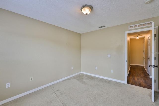 11438 Ivy Flower Loop, Riverview, FL 33578 - unfurnished room with carpet floors, a textured ceiling, and a smoke detector