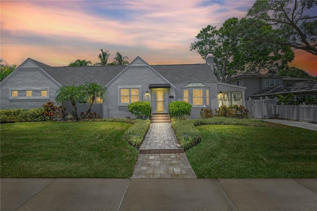 555 21st Ave NE, Saint Petersburg, FL 33704 - view of front facade with roof with shingles and a chimney
