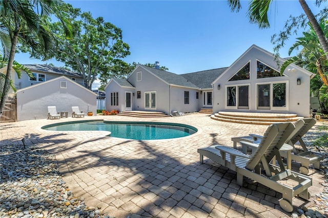 555 21st Ave NE, Saint Petersburg, FL 33704 - outdoor pool featuring entry steps, a patio area, and french doors