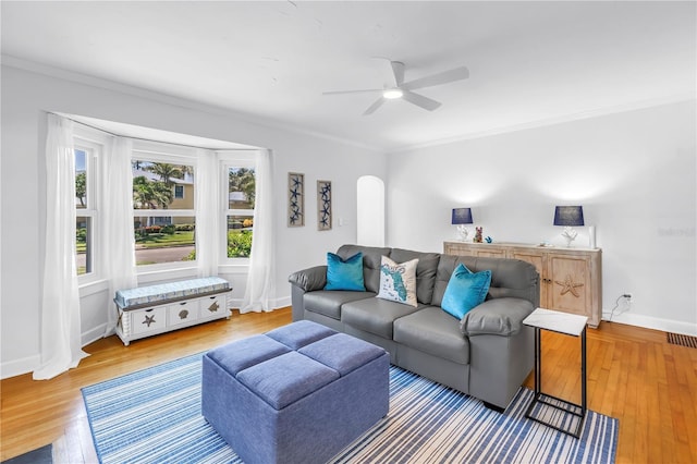 555 21st Ave NE, Saint Petersburg, FL 33704 - living area with ornamental molding, ceiling fan, and wood finished floors