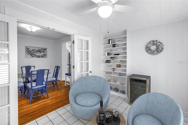 555 21st Ave NE, Saint Petersburg, FL 33704 - living area featuring wine cooler, tile patterned floors, a ceiling fan, and ornamental molding