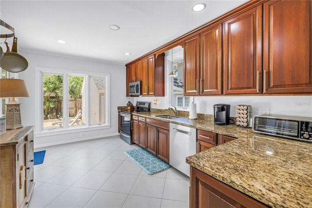 555 21st Ave NE, Saint Petersburg, FL 33704 - kitchen with stainless steel appliances, light stone countertops, recessed lighting, ornamental molding, and light tile patterned floors