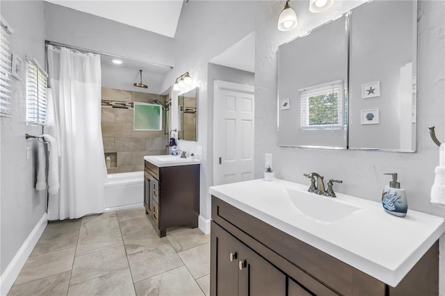 555 21st Ave NE, Saint Petersburg, FL 33704 - bathroom featuring vanity and a combined bath / shower with rainfall shower