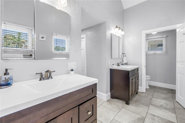 555 21st Ave NE, Saint Petersburg, FL 33704 - bathroom with vanity, a textured wall, and tile patterned flooring