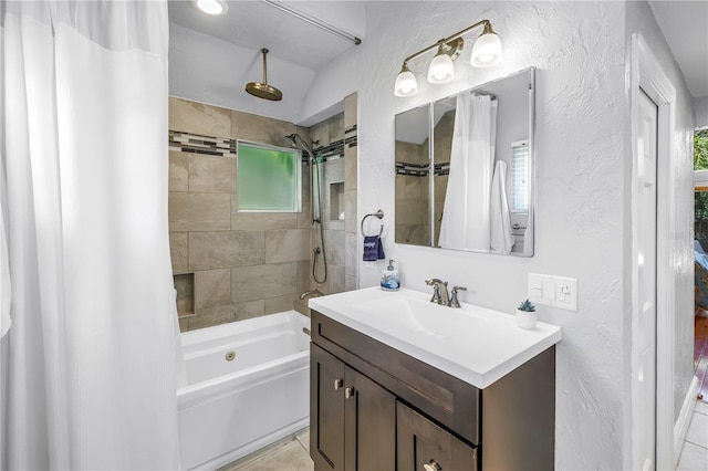 555 21st Ave NE, Saint Petersburg, FL 33704 - full bathroom featuring vanity, a combined bath / shower with rainfall shower, and a textured wall