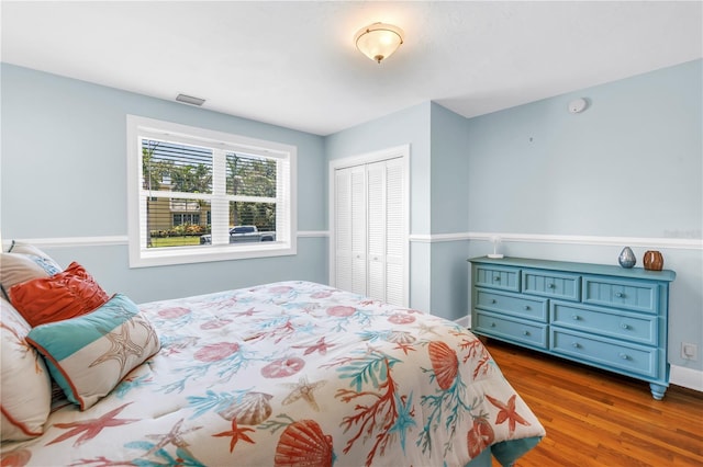 555 21st Ave NE, Saint Petersburg, FL 33704 - bedroom with a closet and wood finished floors