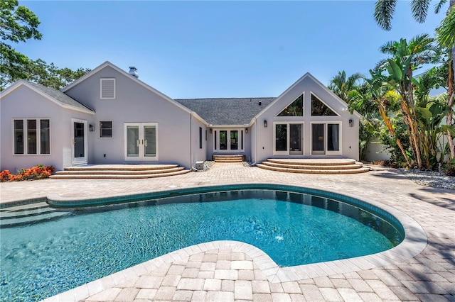 555 21st Ave NE, Saint Petersburg, FL 33704 - outdoor pool featuring french doors, a patio area, and entry steps