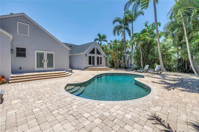555 21st Ave NE, Saint Petersburg, FL 33704 - outdoor pool featuring french doors and a patio area