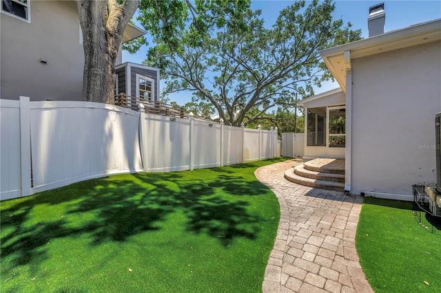 555 21st Ave NE, Saint Petersburg, FL 33704 - fenced yard with a sunroom