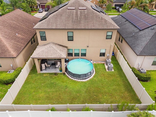 11024 Purple Martin Blvd, Riverview, FL 33579 - back of property with stucco siding, roof with shingles, a fenced backyard, a patio, and a gazebo
