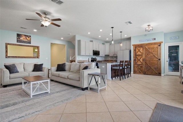 11024 Purple Martin Blvd, Riverview, FL 33579 - living area featuring light tile patterned flooring, a ceiling fan, and recessed lighting