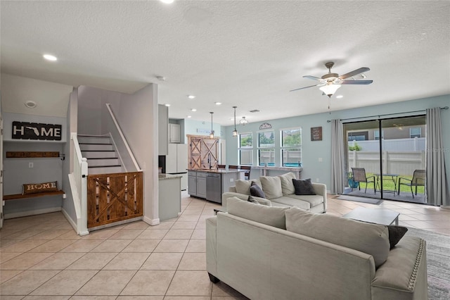 11024 Purple Martin Blvd, Riverview, FL 33579 - living room with a ceiling fan, stairs, light tile patterned floors, a textured ceiling, and recessed lighting