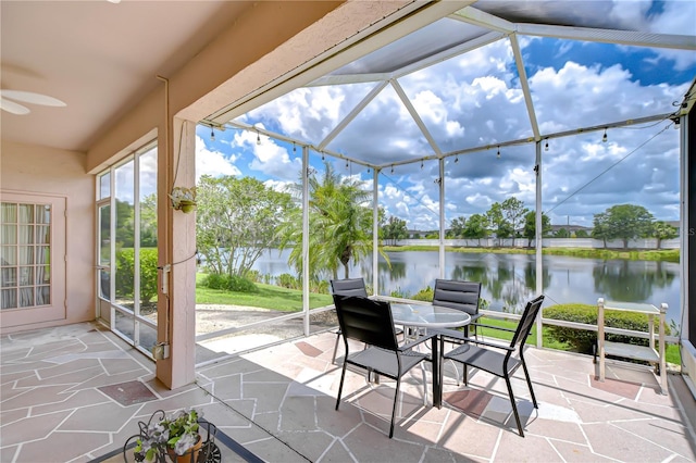 2226 N Creek Ct, Sun City Center, FL 33573 - view of patio / terrace with a water view, glass enclosure, and ceiling fan