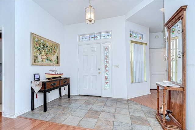 2226 N Creek Ct, Sun City Center, FL 33573 - entrance foyer with baseboards and light stone finish floors
