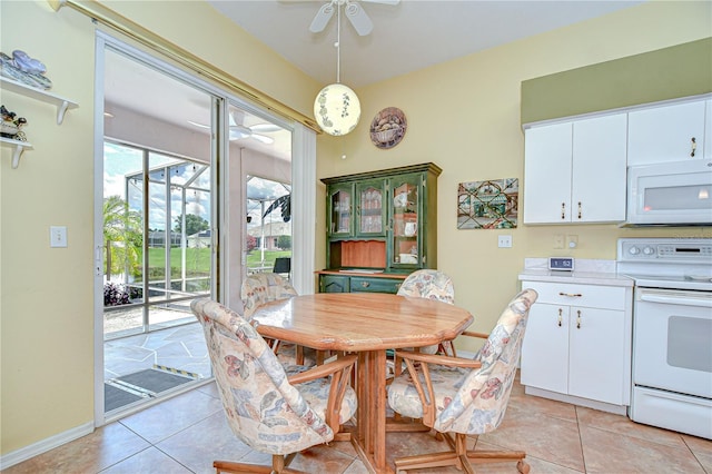 2226 N Creek Ct, Sun City Center, FL 33573 - dining space with a ceiling fan and light tile patterned floors