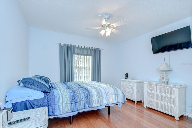 2226 N Creek Ct, Sun City Center, FL 33573 - bedroom featuring wood finished floors and a ceiling fan