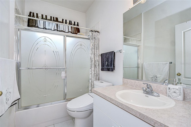 2226 N Creek Ct, Sun City Center, FL 33573 - full bath featuring vanity, shower / bath combination with glass door, and tile patterned floors