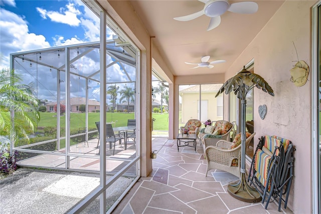 2226 N Creek Ct, Sun City Center, FL 33573 - sunroom / solarium with a ceiling fan, an outdoor hangout area, and plenty of natural light
