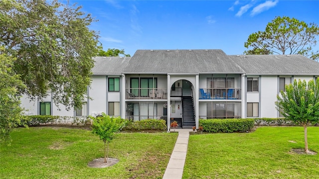 1207 Pine Ridge Cir W Unit H2, Tarpon Springs, FL 34688 - view of property featuring stairs