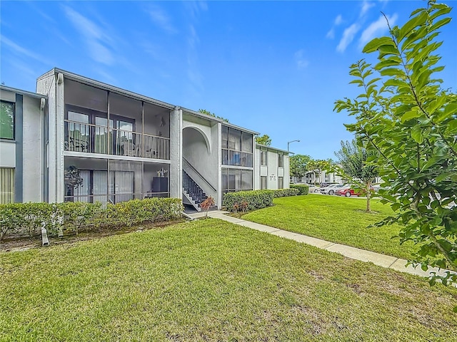 1207 Pine Ridge Cir W Unit H2, Tarpon Springs, FL 34688 - view of property featuring stairway