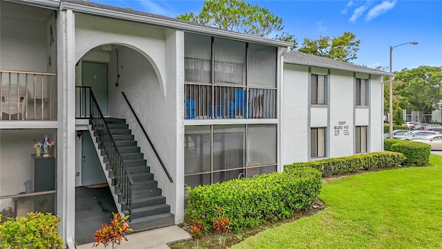 1207 Pine Ridge Cir W Unit H2, Tarpon Springs, FL 34688 - view of property featuring stairway