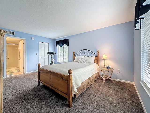 1207 Pine Ridge Cir W Unit H2, Tarpon Springs, FL 34688 - carpeted bedroom with a textured ceiling and a closet