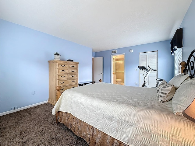 1207 Pine Ridge Cir W Unit H2, Tarpon Springs, FL 34688 - carpeted bedroom featuring baseboards and ensuite bathroom