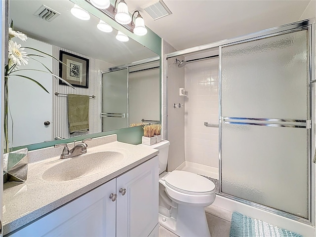 1207 Pine Ridge Cir W Unit H2, Tarpon Springs, FL 34688 - full bathroom featuring a shower stall, vanity, and tile patterned flooring