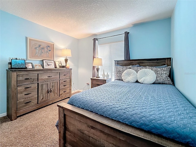 1207 Pine Ridge Cir W Unit H2, Tarpon Springs, FL 34688 - carpeted bedroom featuring a textured ceiling