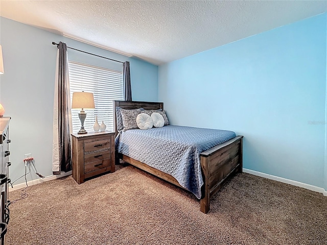 1207 Pine Ridge Cir W Unit H2, Tarpon Springs, FL 34688 - carpeted bedroom with baseboards and a textured ceiling