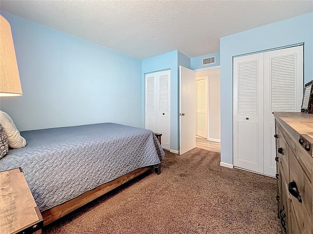 1207 Pine Ridge Cir W Unit H2, Tarpon Springs, FL 34688 - carpeted bedroom with two closets