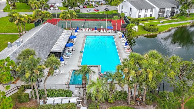 1207 Pine Ridge Cir W Unit H2, Tarpon Springs, FL 34688 - bird's eye view of a pool area and a nearby body of water