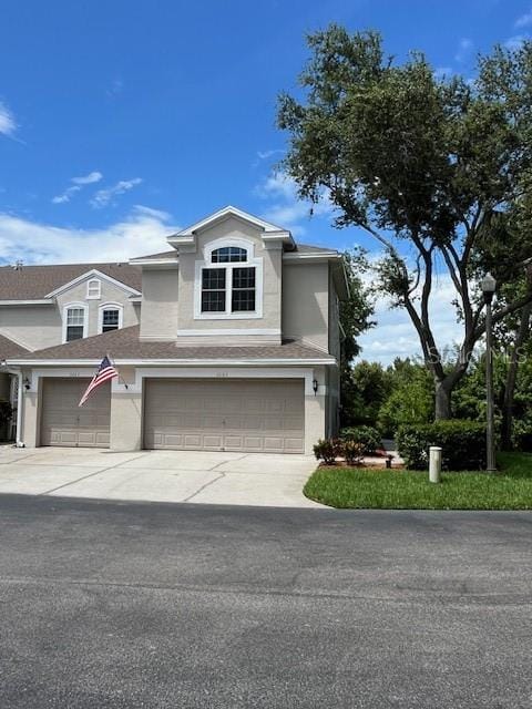 3665 Country Pointe Pl, Palm Harbor, FL 34684 - traditional-style house with driveway, an attached garage, and a shingled roof