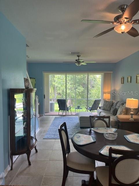 3665 Country Pointe Pl, Palm Harbor, FL 34684 - dining room featuring ceiling fan and light tile patterned flooring