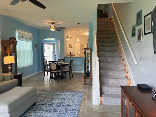 3665 Country Pointe Pl, Palm Harbor, FL 34684 - tiled living area featuring a ceiling fan and stairs