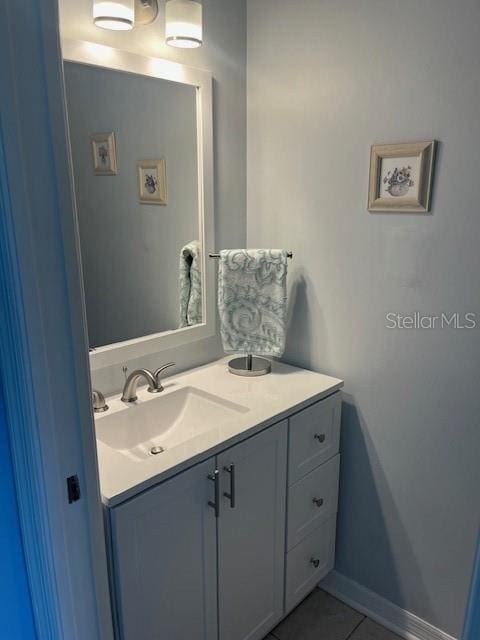 3665 Country Pointe Pl, Palm Harbor, FL 34684 - bathroom featuring vanity and tile patterned flooring