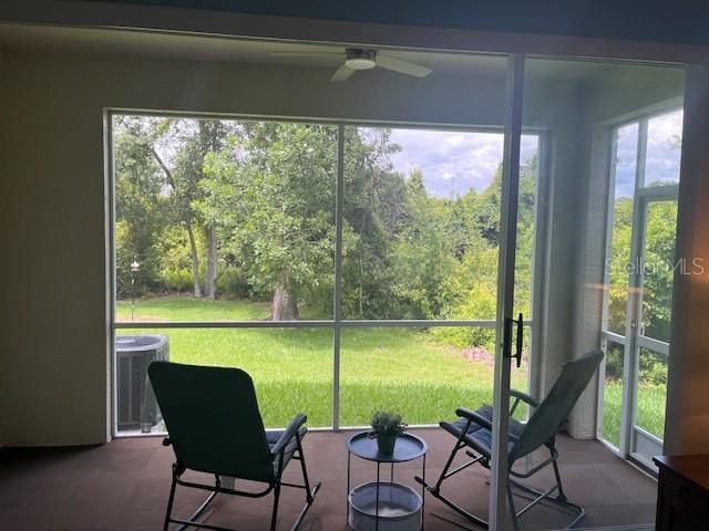 3665 Country Pointe Pl, Palm Harbor, FL 34684 - sunroom featuring ceiling fan