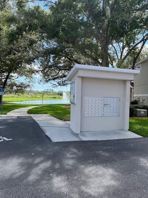 3665 Country Pointe Pl, Palm Harbor, FL 34684 - view of property's community with mail area and a water view